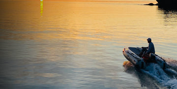 Man on Takacat riding towards sunset